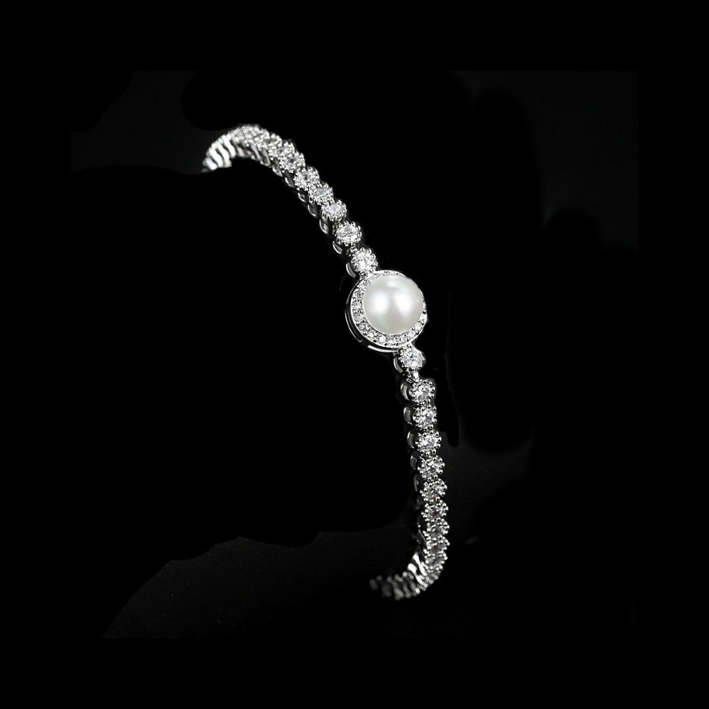 Zirkonia kristallen armband met grote parel in het midden